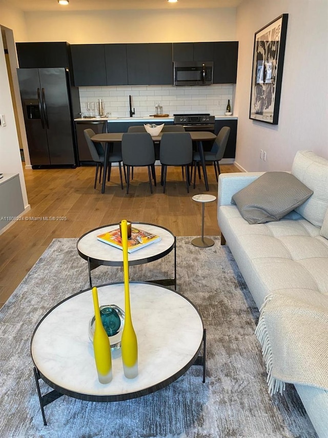 398 NE 5th St Unit 1619, Miami, FL 33132 - living area with light wood-style flooring, baseboards, and recessed lighting
