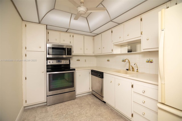 900 Saint Charles Pl Unit 616, Pembroke Pines, FL 33026 - kitchen with appliances with stainless steel finishes, a sink, decorative backsplash, and a ceiling fan