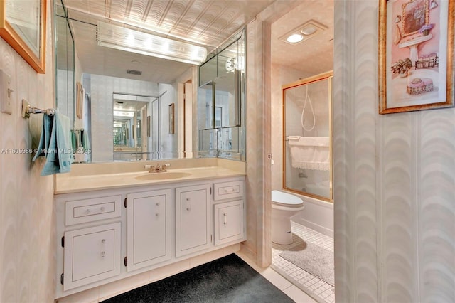 900 Saint Charles Pl Unit 616, Pembroke Pines, FL 33026 - full bath featuring toilet, tile patterned flooring, vanity, enclosed tub / shower combo, and wallpapered walls