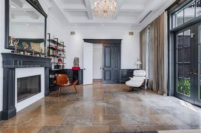 9320 Gallardo St, Coral Gables, FL 33156 - foyer featuring stone tile flooring, a fireplace, a high ceiling, coffered ceiling, and beam ceiling