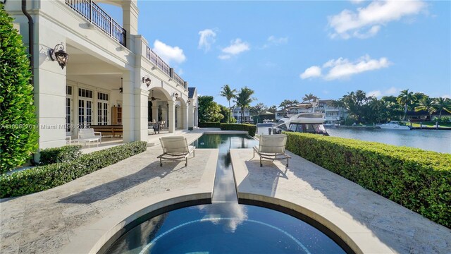 9320 Gallardo St, Coral Gables, FL 33156 - swimming pool featuring a patio, french doors, and a water view