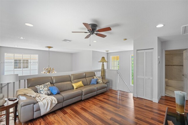 1282 Grant Ct, Hollywood, FL 33019 - living room with wood finished floors, healthy amount of natural light, recessed lighting, ceiling fan, and baseboards
