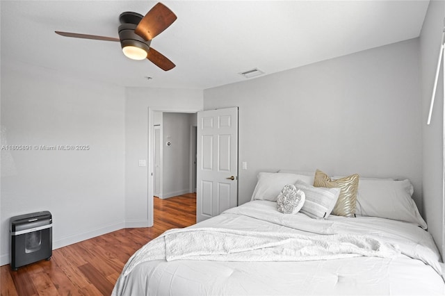 1282 Grant Ct, Hollywood, FL 33019 - bedroom featuring wood finished floors, a ceiling fan, and baseboards