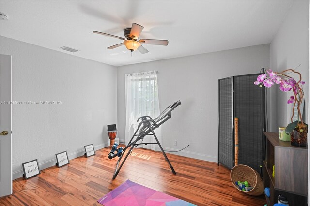 1282 Grant Ct, Hollywood, FL 33019 - exercise area featuring ceiling fan, wood finished floors, and baseboards