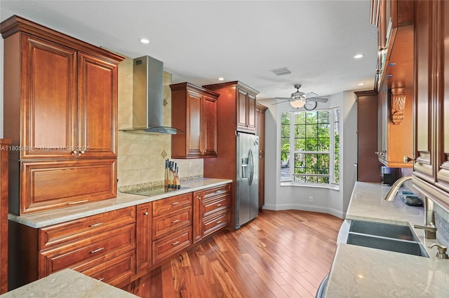 1282 Grant Ct, Hollywood, FL 33019 - kitchen with wall chimney exhaust hood, stainless steel fridge with ice dispenser, a sink, baseboards, and hardwood / wood-style flooring