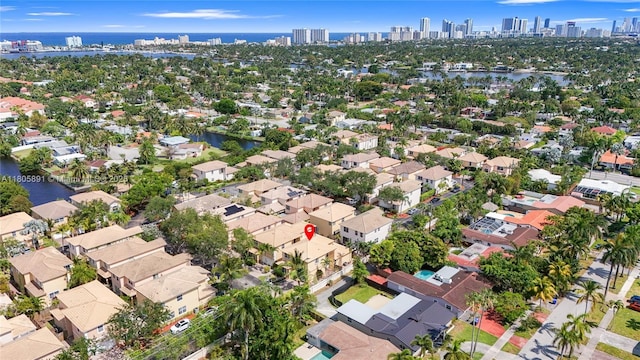 1282 Grant Ct, Hollywood, FL 33019 - aerial overview of property's location with city skyline, a large body of water, and nearby suburban area