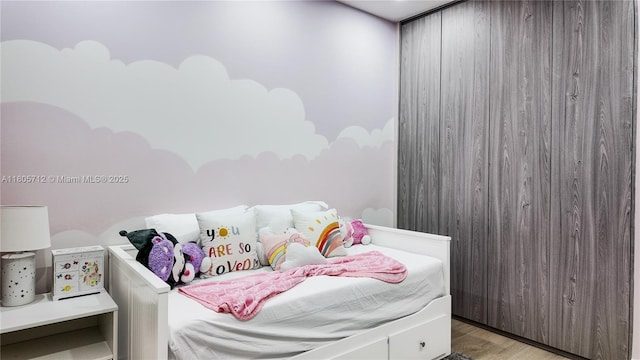 bedroom featuring light wood-style floors