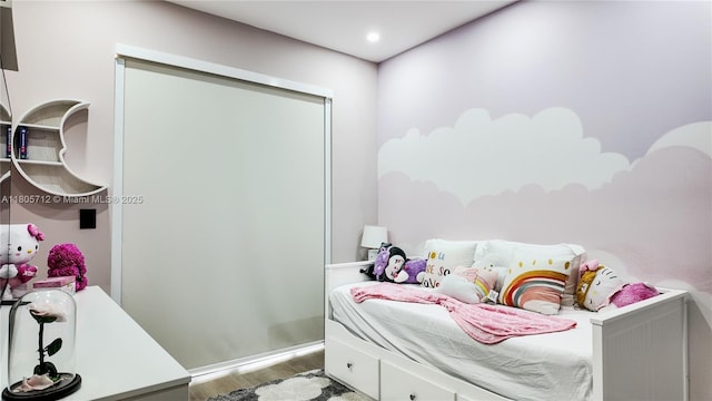 bedroom with wood finished floors
