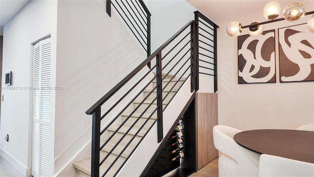 staircase featuring wood finished floors