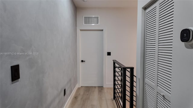 hallway featuring light wood-style floors