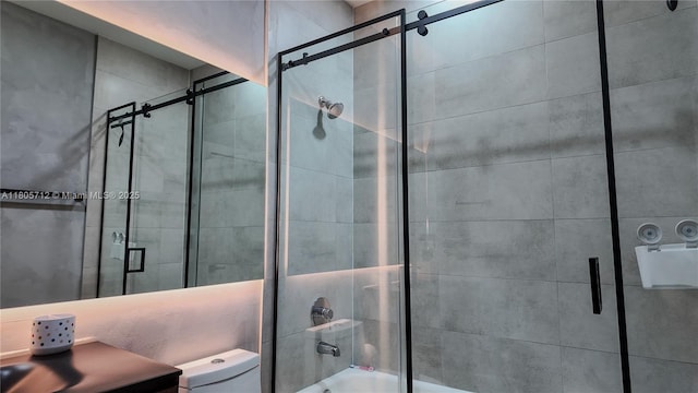 full bathroom featuring toilet and combined bath / shower with glass door