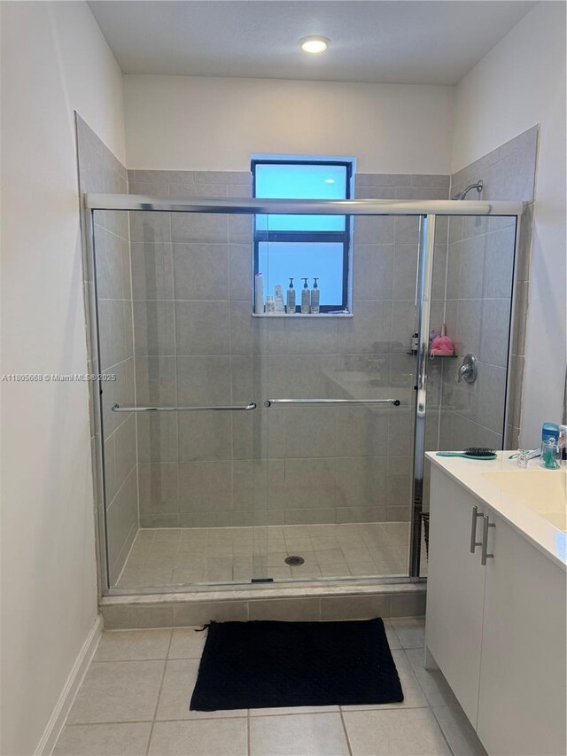 12956 SW 286th Ter, Homestead, FL 33033 - bathroom featuring tile patterned flooring, a shower stall, vanity, and recessed lighting