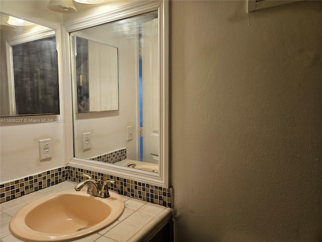8620 N Sherman Cir Unit 202, Miramar, FL 33025 - bathroom with tasteful backsplash and vanity