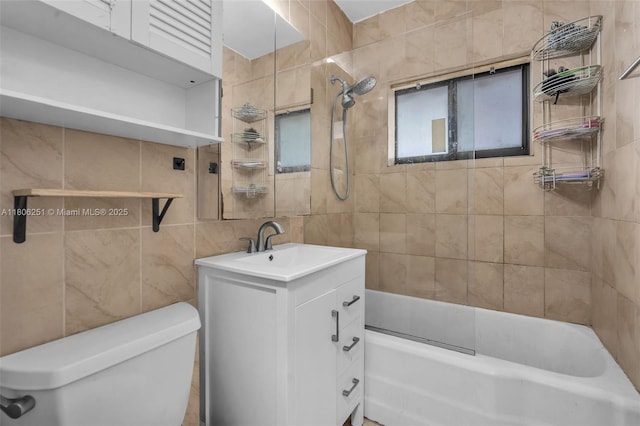 1635 NE 174th St, North Miami Beach, FL 33162 - bathroom with tile walls, toilet, vanity, and shower / tub combination