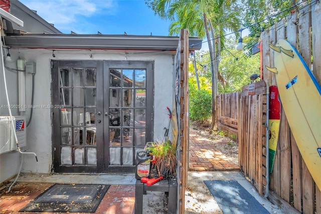 1635 NE 174th St, North Miami Beach, FL 33162 - entrance to property featuring french doors and stucco siding