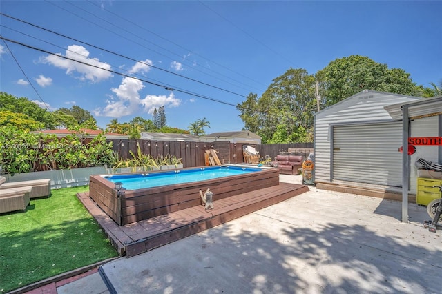 1635 NE 174th St, North Miami Beach, FL 33162 - view of patio / terrace with a deck and an outbuilding