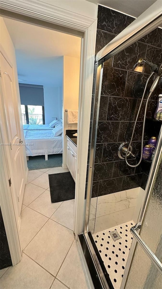 180 Seaview Ct Unit 706, Marco Island, FL 34145 - full bathroom with ensuite bath, a stall shower, tile patterned flooring, and vanity