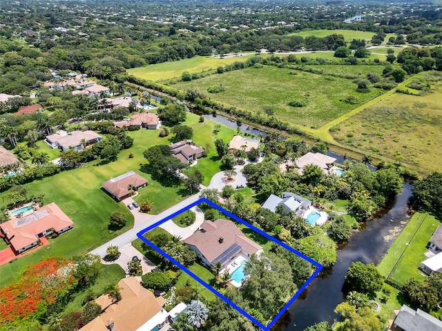 11850 SW 42nd Ct, Davie, FL 33330 - aerial perspective of suburban area with property parcel outlined and a large body of water