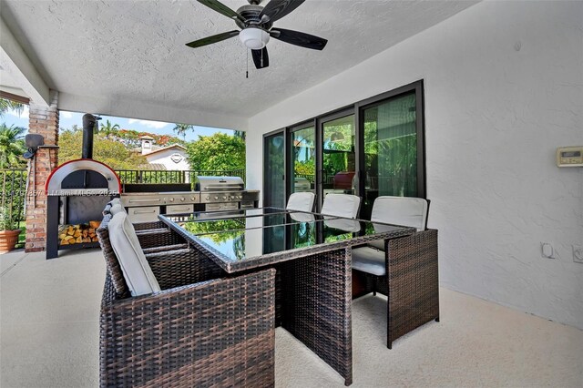 11850 SW 42nd Ct, Davie, FL 33330 - view of patio / terrace with a ceiling fan and a fireplace