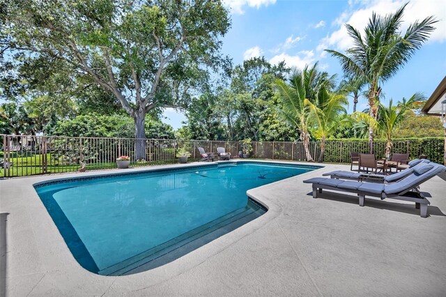11850 SW 42nd Ct, Davie, FL 33330 - view of swimming pool with a patio area