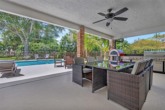 11850 SW 42nd Ct, Davie, FL 33330 - fenced backyard featuring ceiling fan, a patio, and grilling area