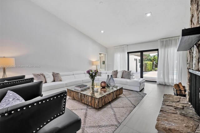 11850 SW 42nd Ct, Davie, FL 33330 - living area with a fireplace with raised hearth, tile patterned flooring, recessed lighting, and lofted ceiling