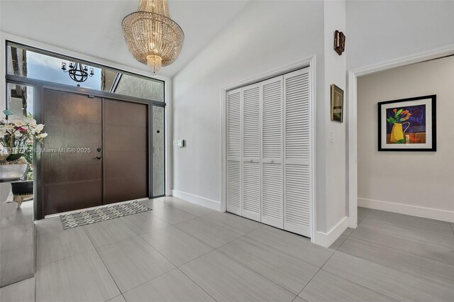 11850 SW 42nd Ct, Davie, FL 33330 - entrance foyer with a chandelier, tile patterned flooring, and baseboards