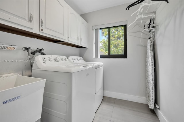 11850 SW 42nd Ct, Davie, FL 33330 - washroom featuring cabinet space, independent washer and dryer, baseboards, and light tile patterned floors