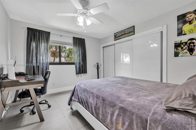 11850 SW 42nd Ct, Davie, FL 33330 - bedroom featuring light tile patterned floors, a closet, baseboards, a desk, and ceiling fan