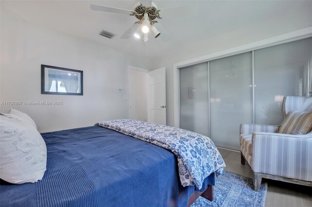 11850 SW 42nd Ct, Davie, FL 33330 - bedroom with a closet, ceiling fan, and wood finished floors
