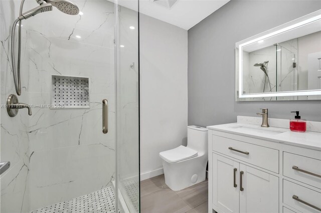 11850 SW 42nd Ct, Davie, FL 33330 - bathroom featuring a marble finish shower, toilet, vanity, and baseboards