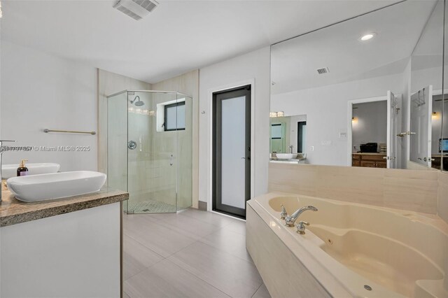 11850 SW 42nd Ct, Davie, FL 33330 - full bathroom with a stall shower, a whirlpool tub, vanity, tile patterned flooring, and recessed lighting