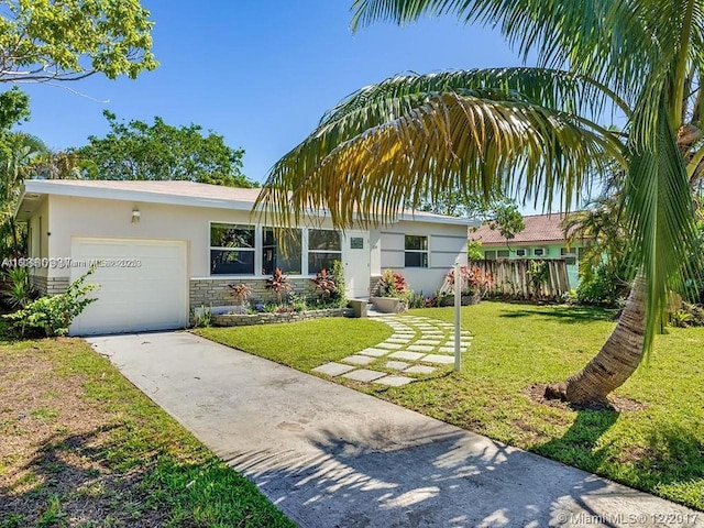 1231 N 16th Ct, Hollywood, FL 33020 - single story home with concrete driveway, stucco siding, an attached garage, stone siding, and a front lawn