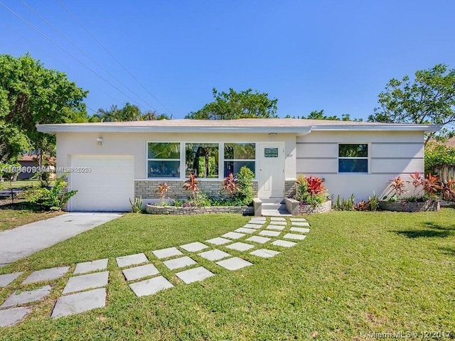 1231 N 16th Ct, Hollywood, FL 33020 - single story home with driveway, stone siding, stucco siding, and a front yard
