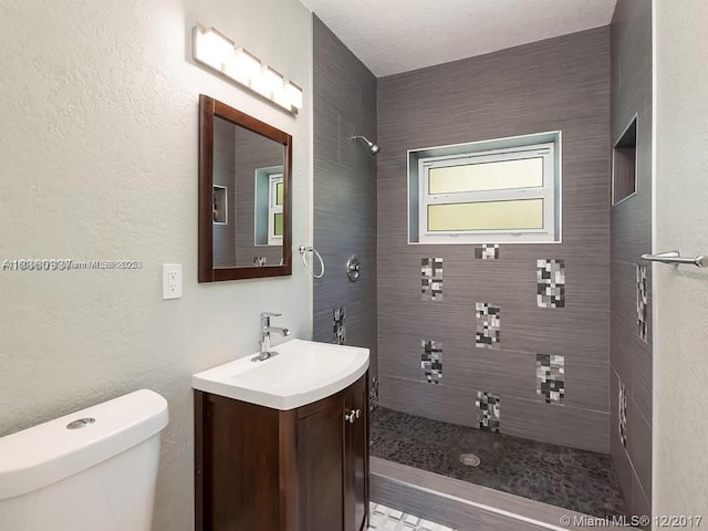 1231 N 16th Ct, Hollywood, FL 33020 - full bathroom with a tile shower, toilet, and vanity