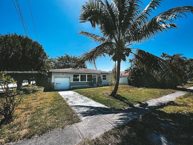 1231 N 16th Ct, Hollywood, FL 33020 - single story home with a front lawn, a garage, driveway, and stucco siding