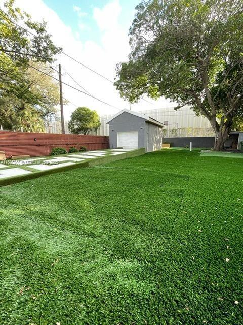 1416 SW 33ct, Fort Lauderdale, FL 33315 - view of yard with an outdoor structure and a detached garage
