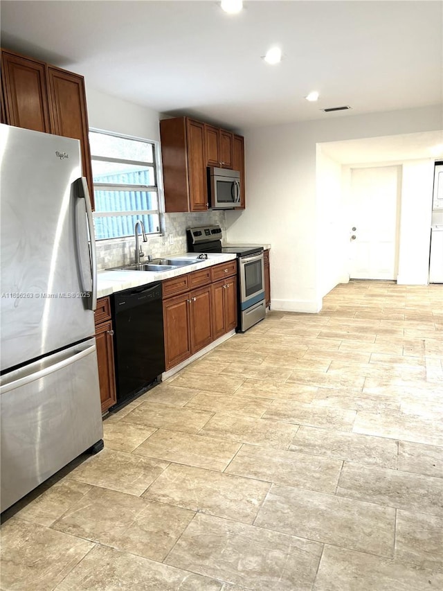 1416 SW 33ct, Fort Lauderdale, FL 33315 - kitchen with stainless steel appliances, a sink, light countertops, tasteful backsplash, and recessed lighting