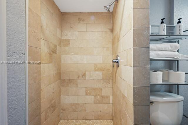 1416 SW 33ct, Fort Lauderdale, FL 33315 - bathroom featuring a stall shower and toilet