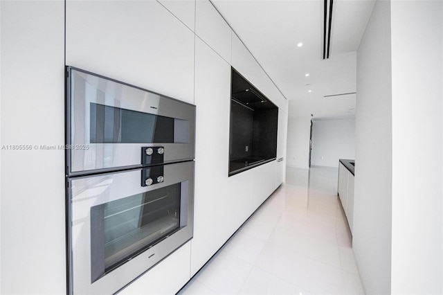 300 Biscayne Boulevard Way Unit 4507W, Miami, FL 33131 - kitchen featuring modern cabinets, white cabinets, stainless steel double oven, light tile patterned flooring, and recessed lighting