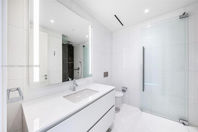 300 Biscayne Boulevard Way Unit 4507W, Miami, FL 33131 - full bath featuring vanity, tiled shower, toilet, recessed lighting, and tile walls