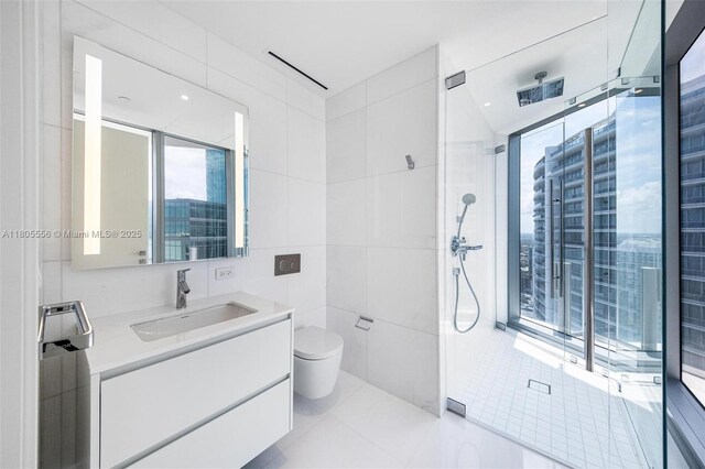 300 Biscayne Boulevard Way Unit 4507W, Miami, FL 33131 - bathroom with tile walls, healthy amount of natural light, walk in shower, and vanity
