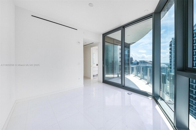 300 Biscayne Boulevard Way Unit 4507W, Miami, FL 33131 - empty room with baseboards, expansive windows, and tile patterned flooring