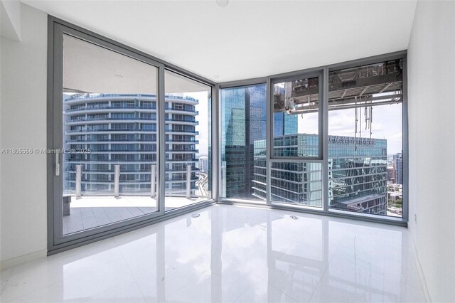 300 Biscayne Boulevard Way Unit 4507W, Miami, FL 33131 - tiled spare room featuring plenty of natural light, a wall of windows, and a city view