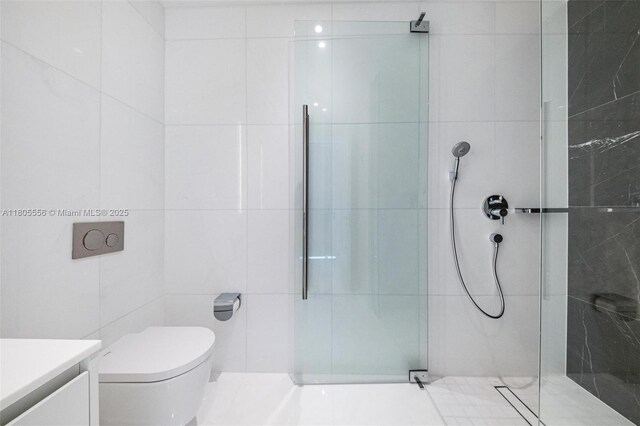 300 Biscayne Boulevard Way Unit 4507W, Miami, FL 33131 - bathroom with tile walls, a tile shower, toilet, and vanity