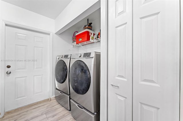 1812 NW 69th Ter, Miami, FL 33147 - washroom with separate washer and dryer and light wood-style floors