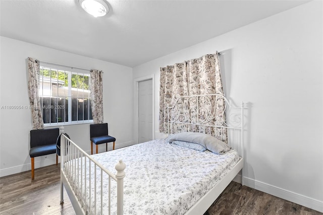 1812 NW 69th Ter, Miami, FL 33147 - bedroom featuring baseboards and wood finished floors