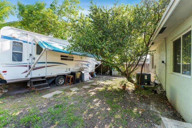 1812 NW 69th Ter, Miami, FL 33147 - view of yard with central AC and fence