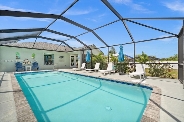 7434 Ashtabula St, Englewood, FL 34224 - outdoor pool featuring french doors, a patio, and glass enclosure