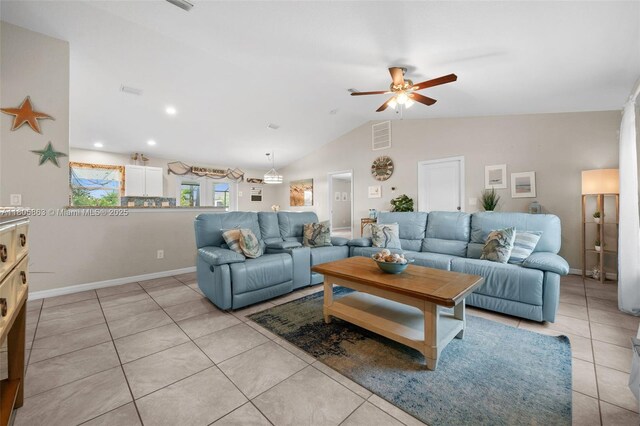 7434 Ashtabula St, Englewood, FL 34224 - living room featuring a ceiling fan, light tile patterned floors, lofted ceiling, and baseboards